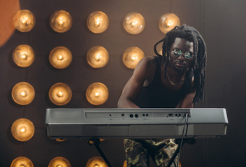 youngmusic producer is making up a music. close eup photo. copy space. improvisation concept