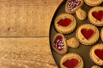 Cookies with jelly hearts on wooden background.Valentine Day Concept.
