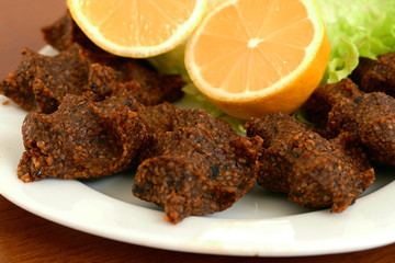 raw meatballs with nuts, specific spicy raw turkey meatballs,(çig köfte)