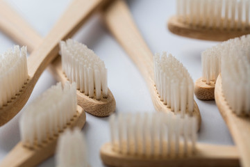 Wooden bamboo toothbrushs on a marble background