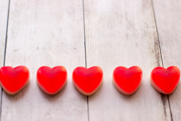 Jelly hearts on the wooden background. Valentine Day Concept.