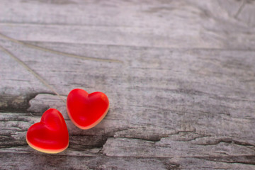 Obraz premium Jelly hearts on the wooden background. Valentine Day Concept.