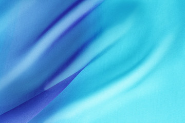 blue transparent fabric with large folds, delicate background