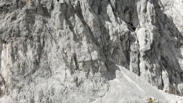 Aerial View Panning Around White Rocky Textured Cliffs
