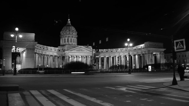 St Petersburg, Russia. Illuminated Cathedral of Our Lady of Kazan, Russian Orthodox Church in Saint Petersburg, Russia at night with car traffic trail lights at the forefront. Time-lapse. Black and wh