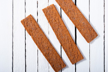 dog biscuits on white wood background