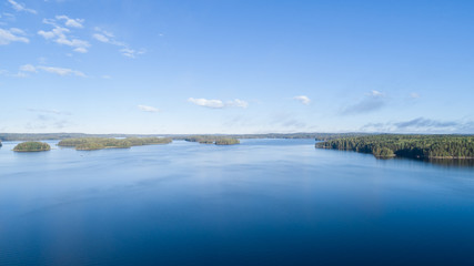 Obraz na płótnie Canvas Beautiful calm lake and clouds. Finnish nature.