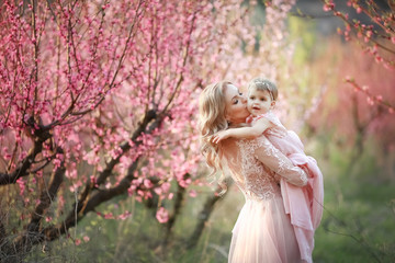 Portrait of young beautiful mother with her little girl. Close up still of loving family....