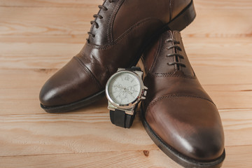 Shoes and watch as accessories to dress elegantly