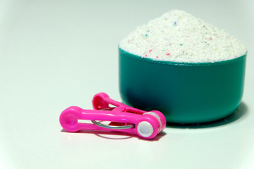 Powder for washing in cups on a white background