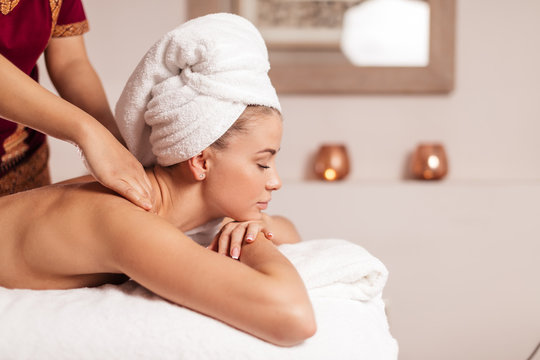 man's hands massaging client's shoulders. close up side view photo. copy space.relaxation, rest .