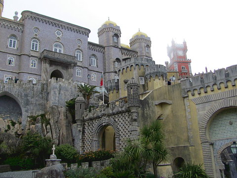 The colorful Pena palace, in Sintra, Lisbon on a foggy day