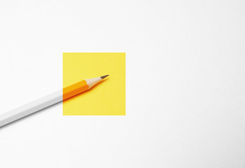 Yellow pencil on white background, minimalism. Creativity, idea, solution, creativity concept.