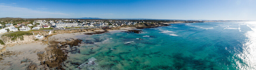 Wide angle landscape image of the dramatic sandstone rock formations along the coastline of...