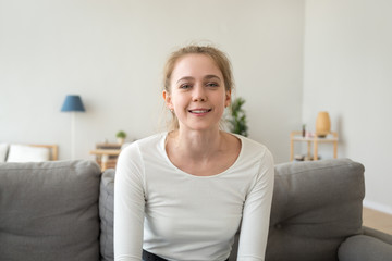 Friendly teen girl youtuber vlogger talking looking at camera
