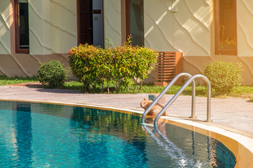 Modern backyard of a swimming pool in public resort or clubhouse