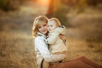 Mother hugging her child during walk in the park