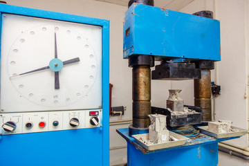 Fototapeta na wymiar Construction laboratory-press for determination of hardness, density and other characteristics of concrete