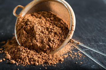 Cocoa powder in a sieve