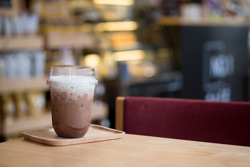 Iced coffee mocha with foam milk in coffee shop