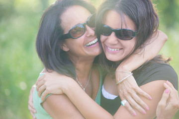 Happy Mother and Daughter Hugging