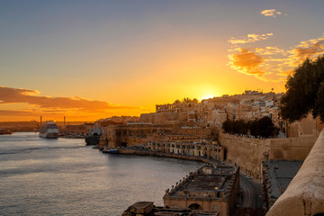 Sunset view of beautiful city of Valletta, capital city of Malta, known in Maltese as Il-Belt, scenic and colourful cityscape.