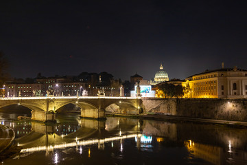 Fototapeta na wymiar Rome night skyline with Vatican St Peter Basilica and St Angelo Bridge crossing Tiber River in the city center of Rome, Italy. It is historic landmark of the Ancient Rome and travel destination.