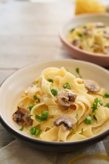 Homemade Fettuccine Alfredo with mushrooms and green peas