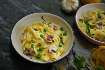Homemade Fettuccine Alfredo with mushrooms and green peas