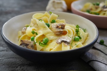 Homemade Fettuccine Alfredo with mushrooms and green peas