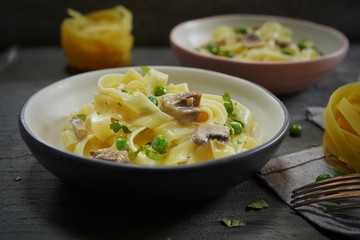 Homemade Fettuccine Alfredo with mushrooms and green peas