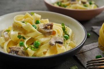Homemade Fettuccine Alfredo with mushrooms and green peas