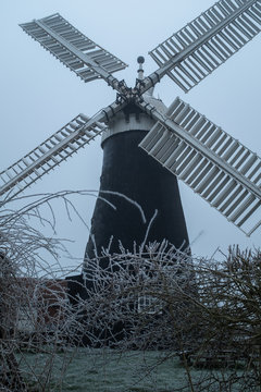 A traditional windmill on a frosty evening