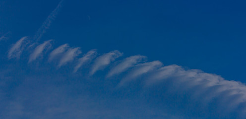 a particular white spiral cloud /a strange cloud that looks like a spiral screw