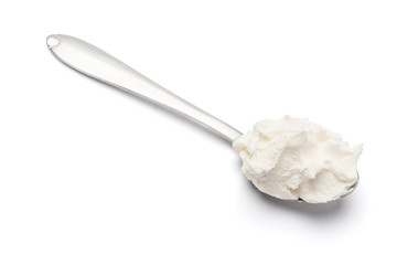 Traditional Mascarpone cheese in spoon isolated on white with clipping path