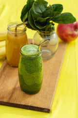 Two colorful fruit smoothies in glass jars