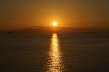 Obraz na płótnie Canvas Calm sea and sunset
