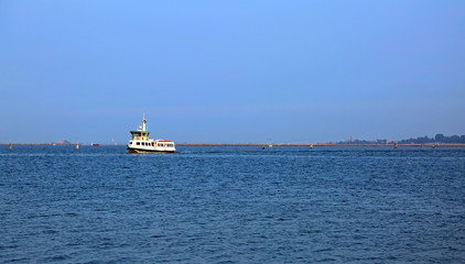 vaporetto furrows the Adriatic sea to bring tourists to the isla