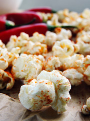 Spicy hot popcorn with chili pepper. Vegan snack