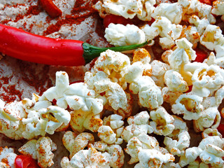 Spicy hot popcorn with chili pepper. Vegan snack