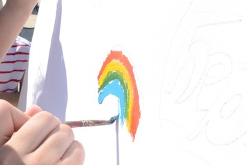 Children draw a rainbow