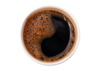 Coffee foam in the form of a Yin-Yang or Dao sign in a disposable paper Cup top view