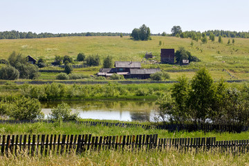 Russia. View of the village. Summer rural landscape with houses