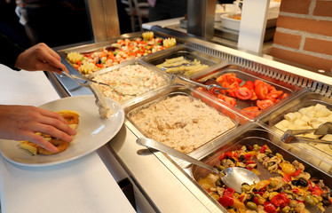 self service restaurant with many raw and cooked foods
