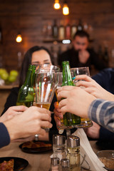 Happy young friends group making a toast about their friendship