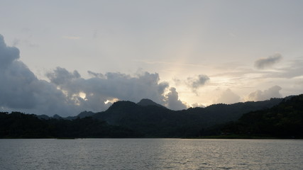 the view of the reddish blue sky at the lake at sunset