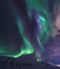 Foto op Plexiglas The polar arctic Northern lights aurora borealis sky star in Norway travel Svalbard in Longyearbyen city the moon mountains © bublik_polina