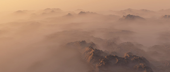 Mountain range in mist at sunrise.