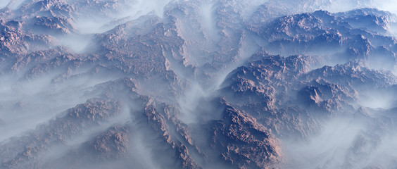 Aerial of rough rock formations in fog.