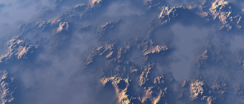 Aerial of rough rocky terrain in mist.